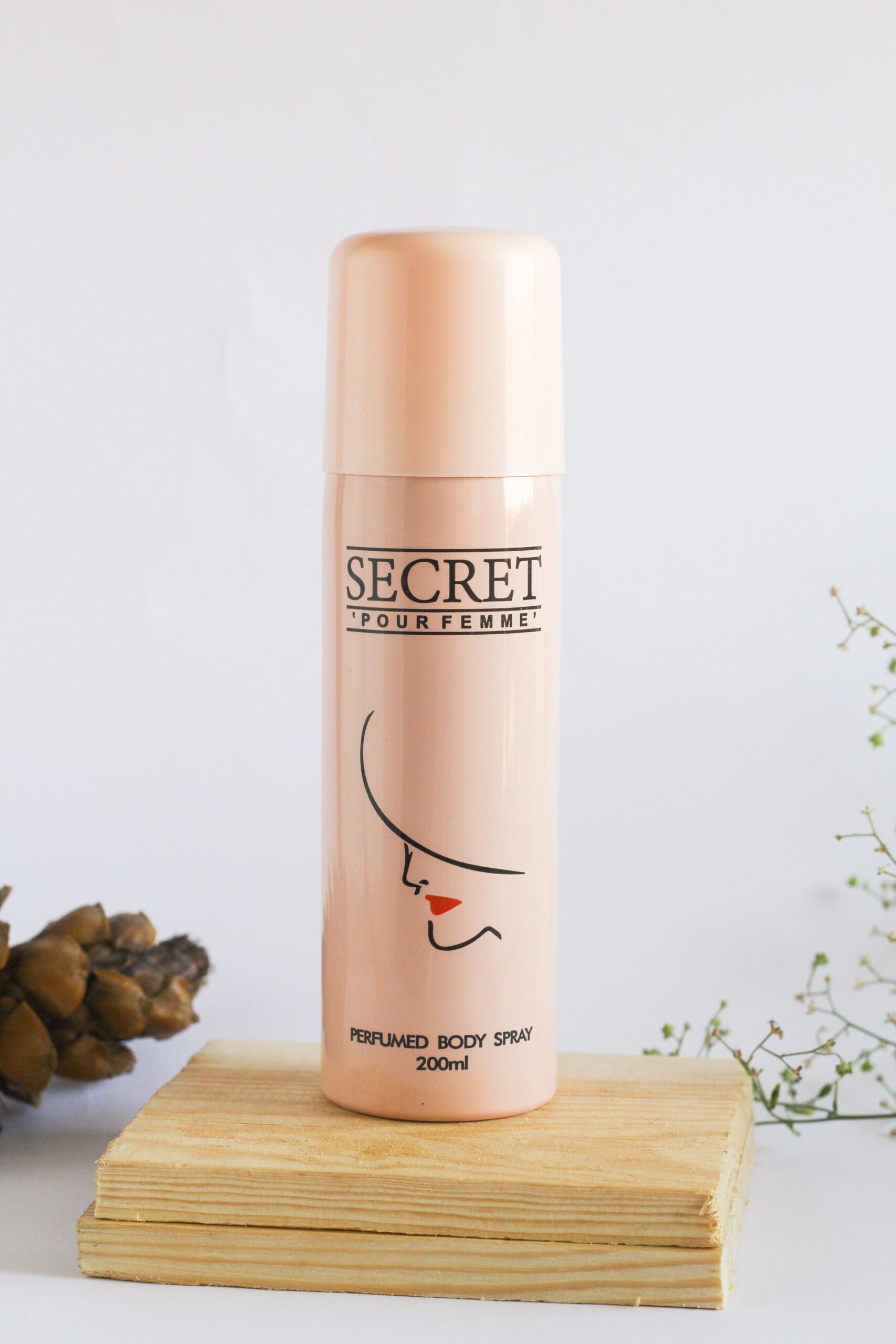 Captivating perfumed body spray bottle on a wooden platform, ideal for beauty product promotions.